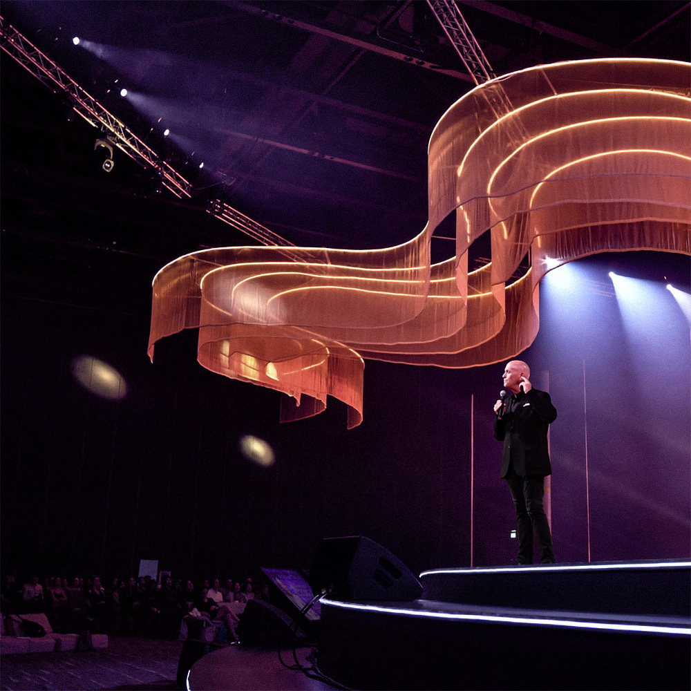 Will Bowen delivering a keynote to a live audience