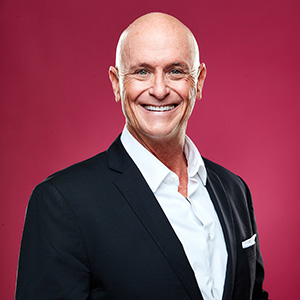 Professional portrait of Will Bowen on a red background